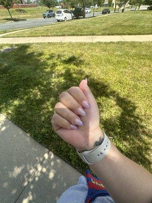 Purple tips with flowers on middle and ring finger