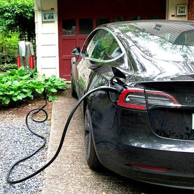 Charging the Tesla from a vintage gas pump at Garret Park, MD