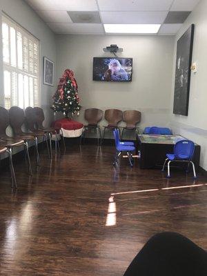 Waiting area with new floors and new kids table