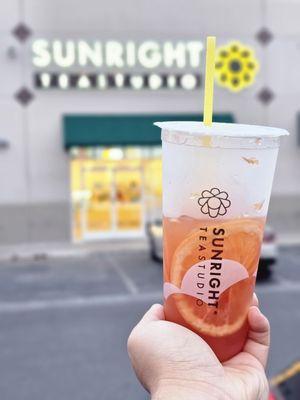 Grapefruit Jasmine, my chunky hand, Sunright Tea Studio in the background.