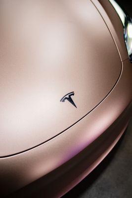 Tesla Model 3 wrapped in Evolv/APA Satin Metallic Rose Gold