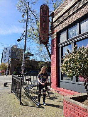 Outdoor seating and Julia's sign