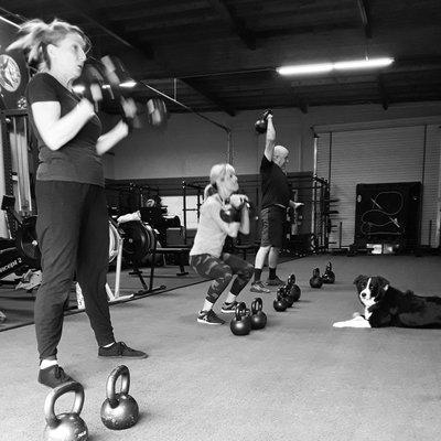 Double kettlebell workout in action.