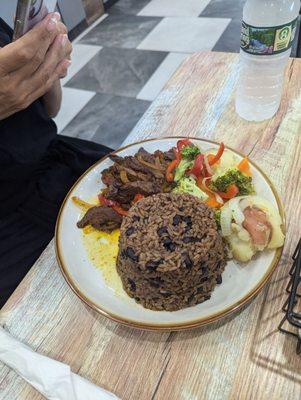 This is the lunch special pepper steak with rice and beans and veggies.