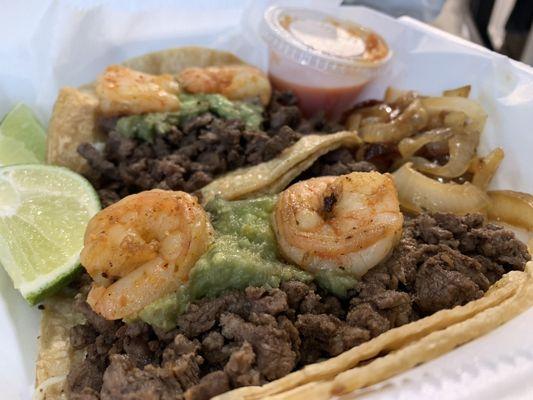 Jaivita (Shrimp and Steak tacos with Avocado and grill onions on the side)