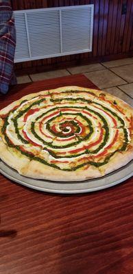 Really good pizza with pesto, ricotta, and sauce. Its like a deconstructed margherita pizza