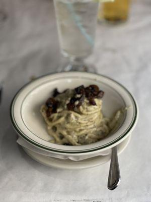 Table side pasta out of the cheese wheel