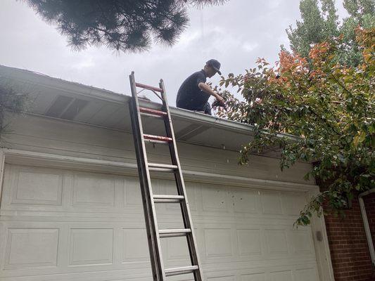 I am cleaning the gutters of my first customer.