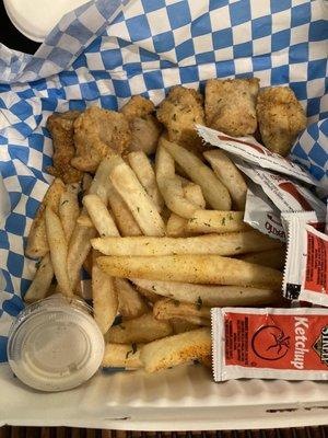 Catfish and fries, with packets of ketchup and Tapatio hot sauce