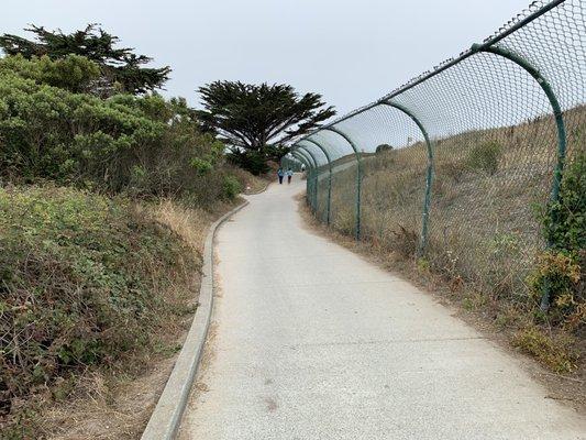 Path to the beach cuts through the golf course.