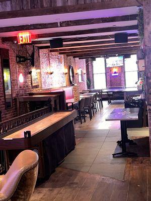 Upstairs shuffleboard and seating area