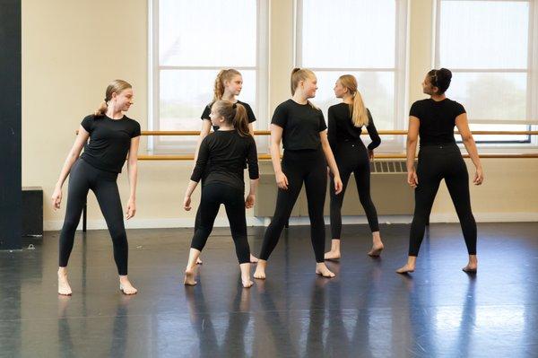 Youth dancers perform during a studio showcase as part of the Summer Intensive