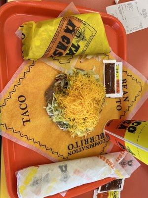 Lunch for two. Bean burrito, super taco, & tostada (did not need to order extra cheese ).