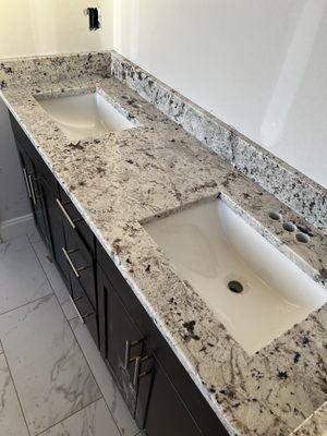 Installed counters, cabinet, and tile combination