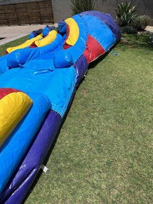 Bounce house plugged in and "installed" without stakes securing it to the ground.