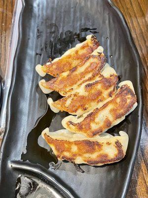 Gyoza. Pork and chicken potsticker pan fried.