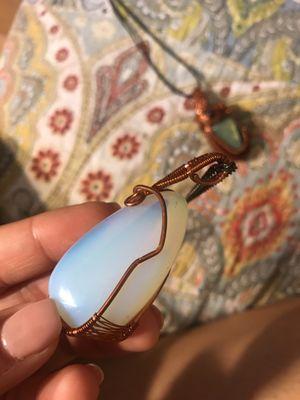 Husband made this opalite necklace pendant. The weaving doesn't go all the way to the top, and the weaving is not the best.