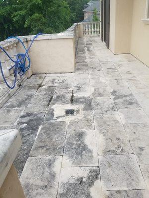 Travertine and limestone patio (before photo). Our plan is to gently clean by power scrubbing surface with removal cleaner.  Houston area