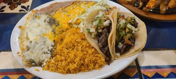 Carne asada tacos and chicken enchilada