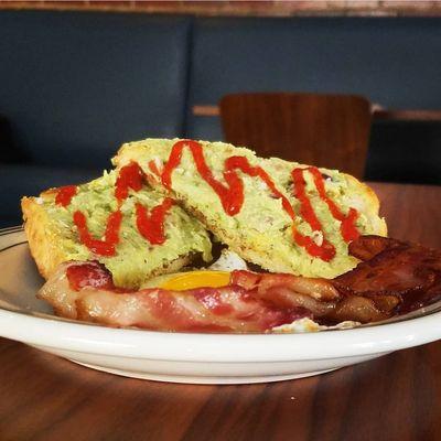 Avocado Toast with bacon and a sunnyside up egg