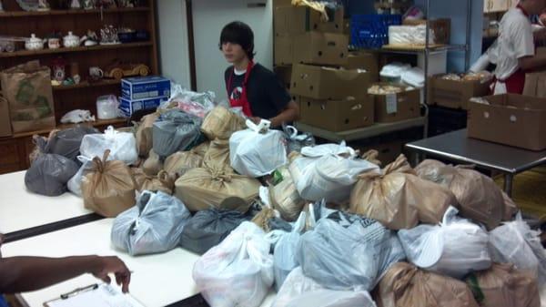 Bags upon bags of canned goods and pre cooked meat, given away by the hundreds every Saturday