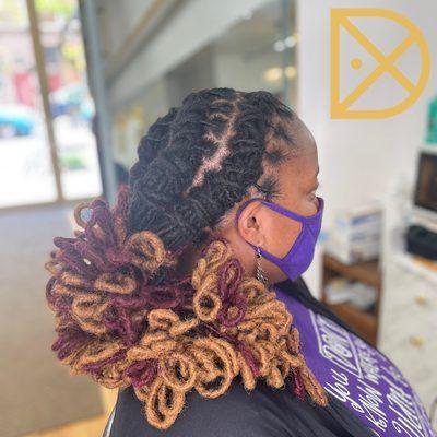 A year ago our client got permanent loc extension. She came in for a wash, retwist, style.