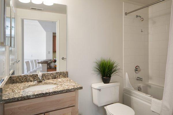 Granite counters and tile floors adorn our spa-inspired bathrooms