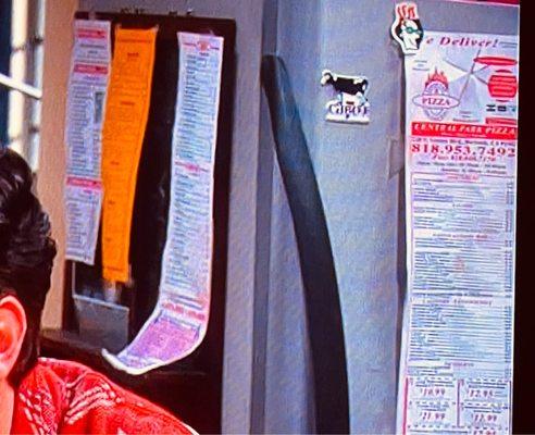 Your pizza flyer is on the refrigerator of The Big Bang Theory