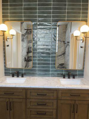 Custom vanity with glass subway tile