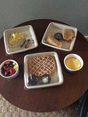 Waffle, scrambled eggs, turkey sausage, buttered grits, power wrap & fruit!