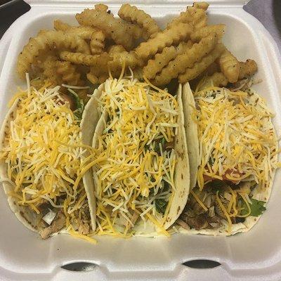 Jerk chicken tacos with fries