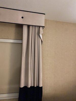 Curtains are falling off the rods on both ends like this.