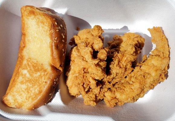 Texas toast and three chicken fingers. The chicken is so tender and juicy, no sauce needed.