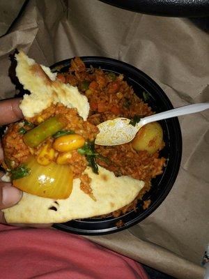 Vegetable biryani and on garlic naan