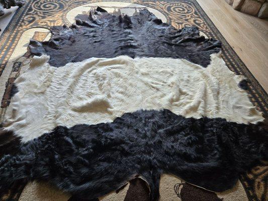 So disappointed...  $700.00+ wasted money. I expected a cow hide rug, not an accident waiting to trip us!