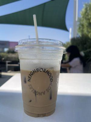 Iced vanilla latte with oat milk