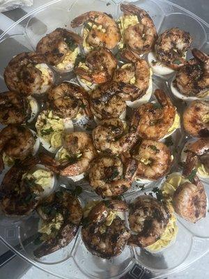 Devil eggs with jerk shrimp on top. catering menu