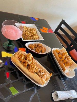 Catfish po boy, shrimp po boy, dirty rice, fried gator, and a delicious watermelon boozy slushee!