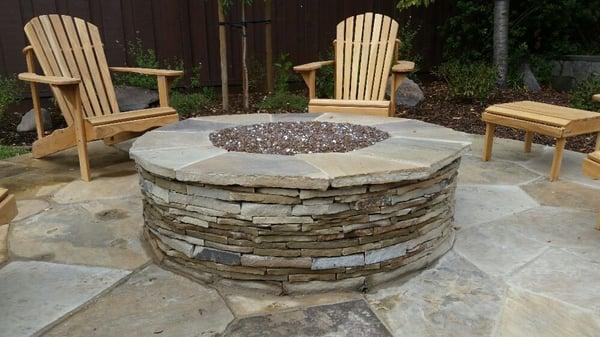 Mahogany ledgestone faced firepit