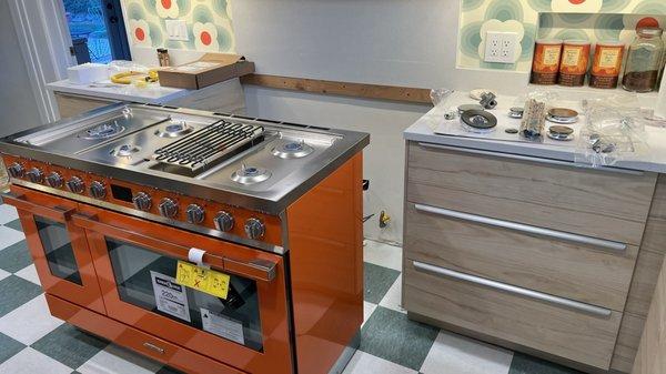 "White glove / concierge delivery service" left stove unassembled and uninstalled in the middle of our kitchen.