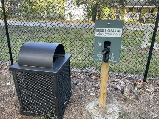 Lots of trash cans and poop bag stations