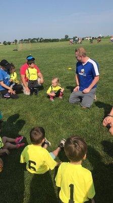 Coach Bobby with the team in a circle!