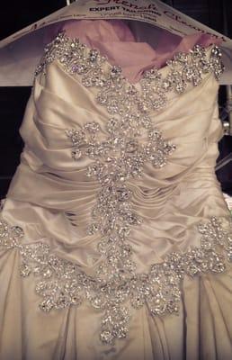 We specialize in wedding gown restoration. This Pnina Tornai gown was restored to its origninal condition after Hurrican Sandy.