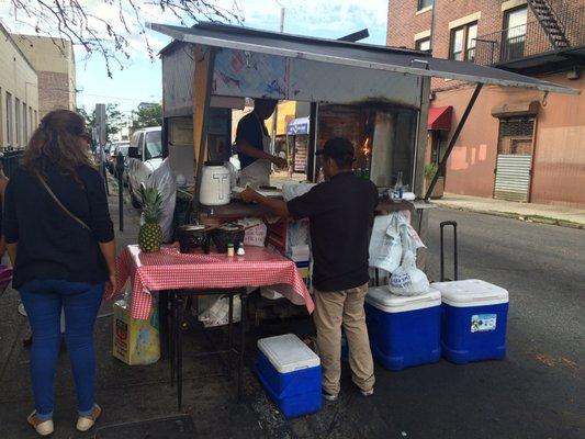 They set up a cart at the street corner on this Saturday afternoon