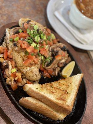 Louisiana bayou style catfish with garlic bread and gumbo on the side