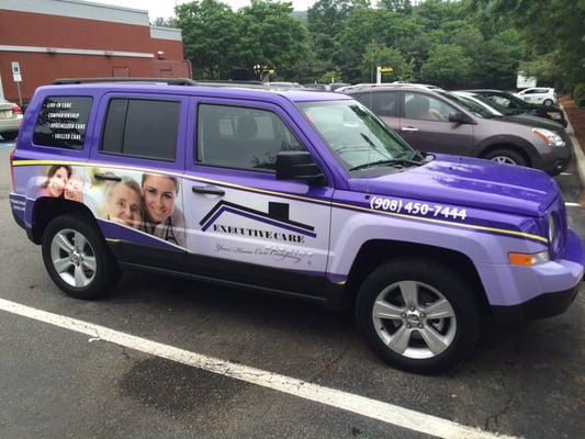 Pictures of the company vehicle and franchise signing.