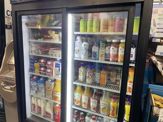 Fridge stocked with staples including eggs, milk