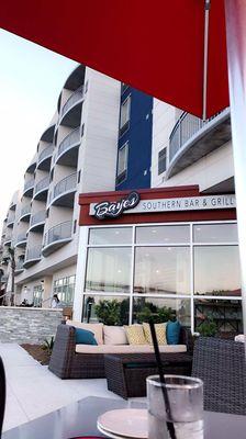 Outdoor seating, attached to the Marriott.