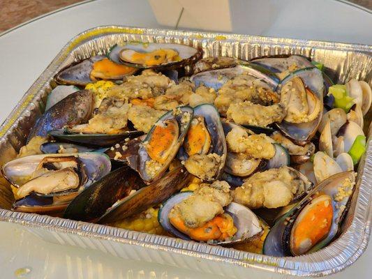 Mussels, clam, fried oysters, potato, and corn from chile crab