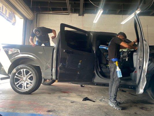 Guys working on our truck tint.